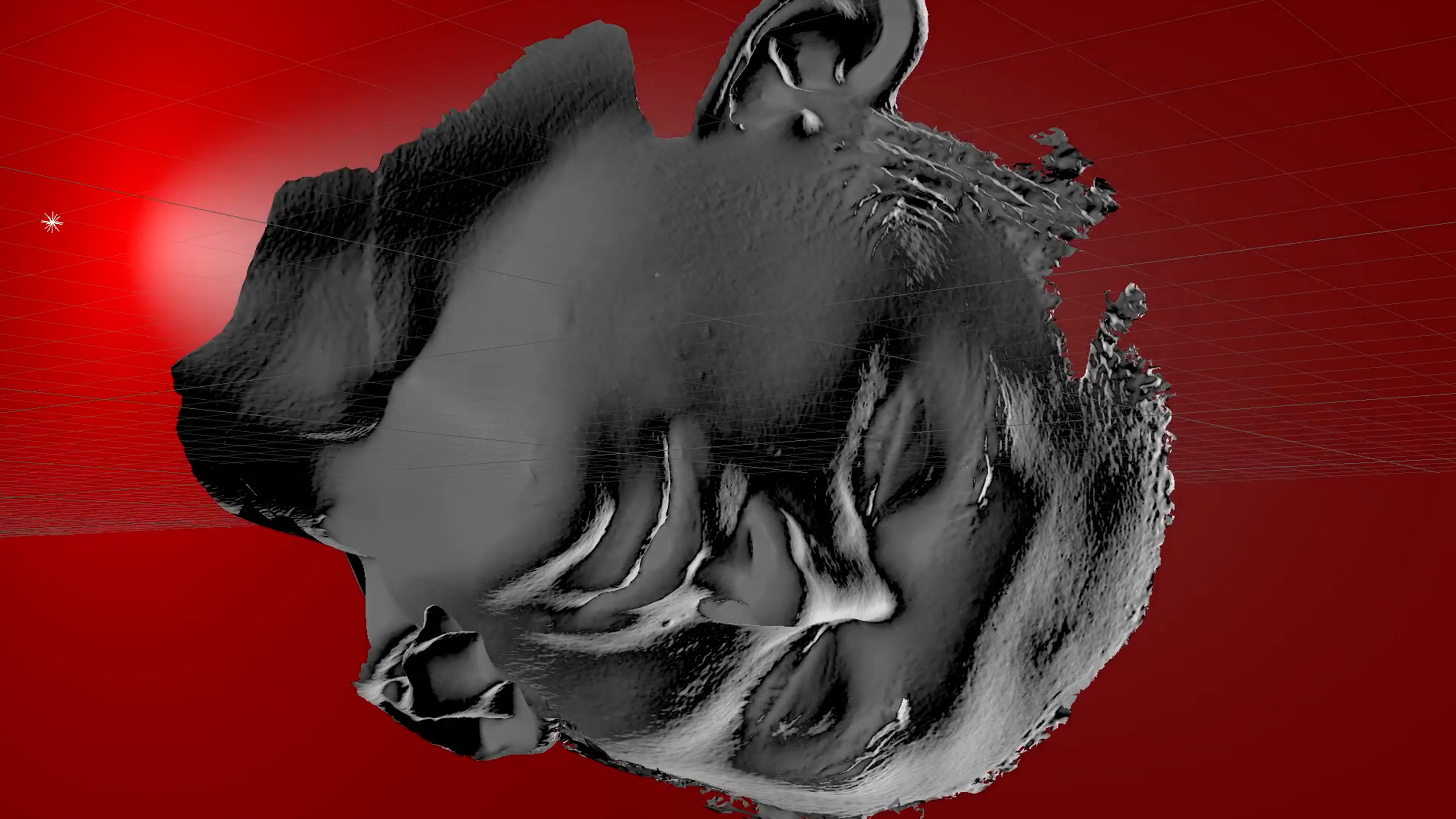 Against a flat red background, a dramatically lit, 3D modeled head lies severed, as if an ancient statue.